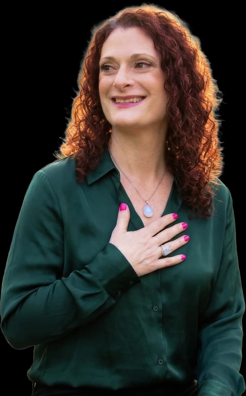 Erica Trestyn, LCSW, with a hand resting on her chest